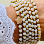 Sautoir Emil en perles à facettes blanches et étoile en agate indienne