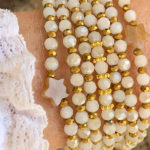 Sautoir Emy en perles à facettes blanche moirée